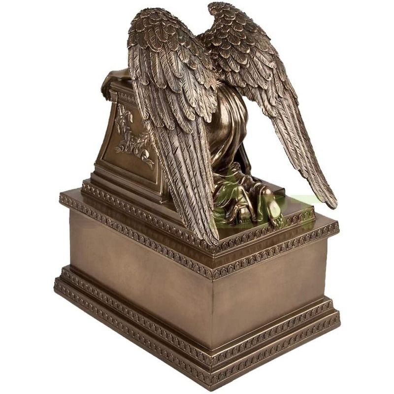 A bronze statue of a quiet little angel