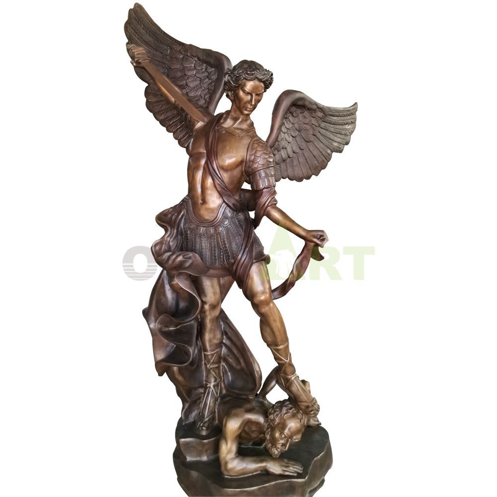 A statue of an angel holding a sword to subdue a demon