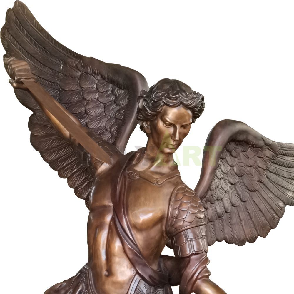 A statue of an angel holding a sword to subdue a demon