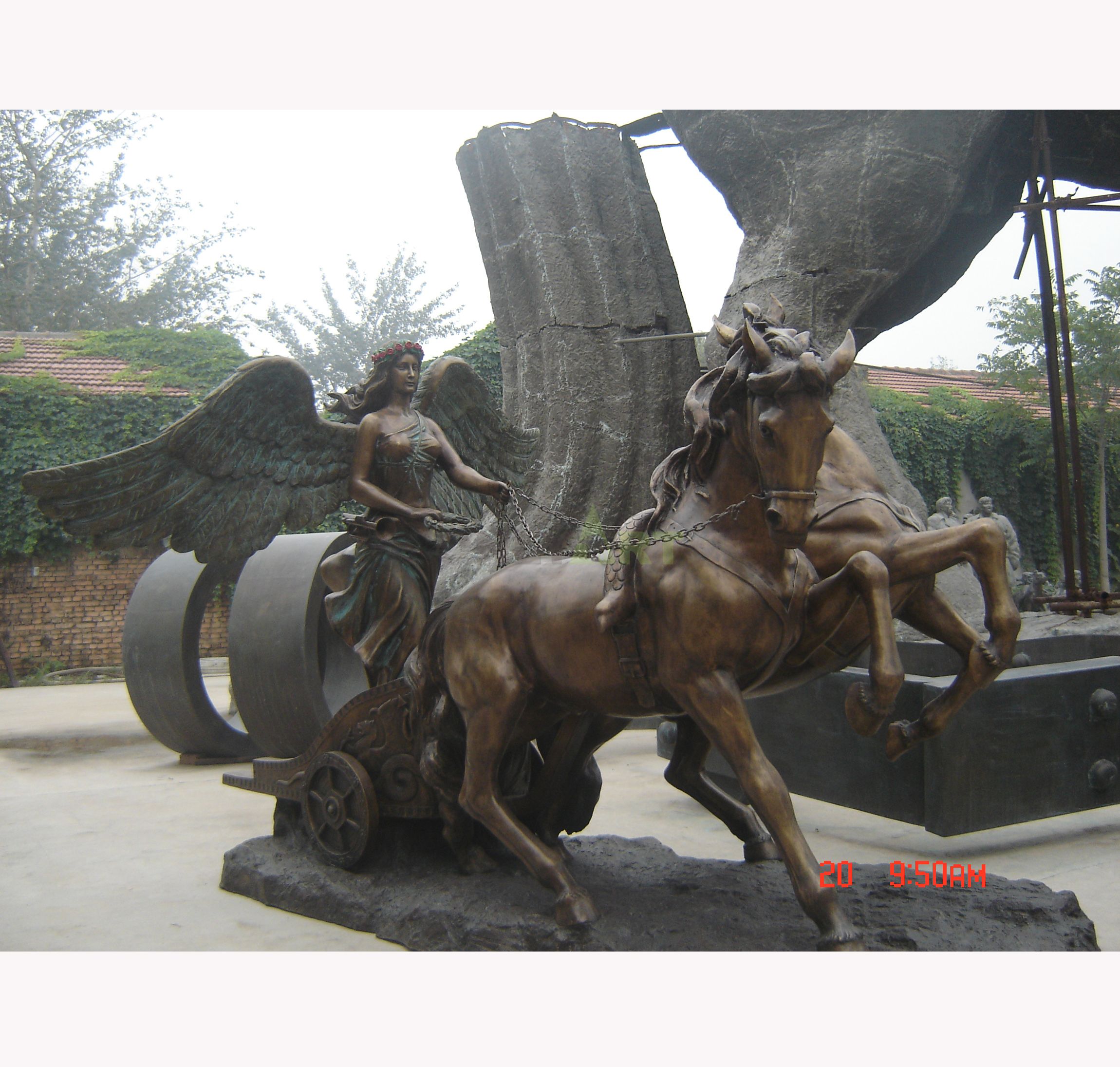 A statue of a heroic angel riding on a horse