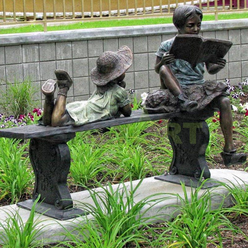 The boy is telling the girl the story, the child sculpture