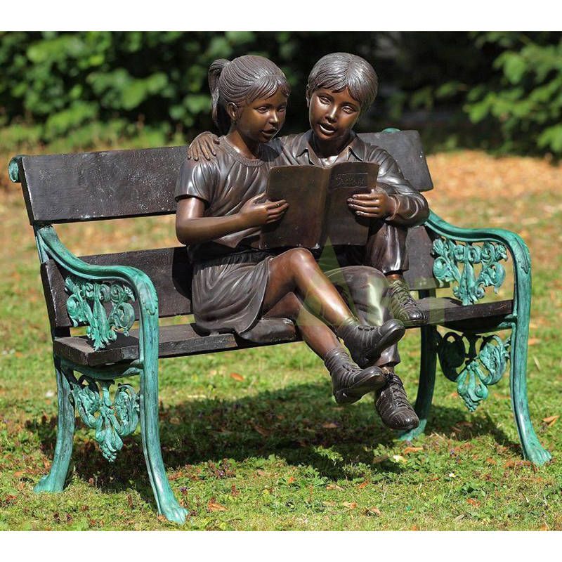 The boy is telling the girl the story, the child sculpture