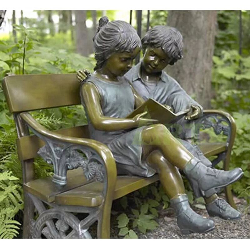 The boy is telling the girl the story, the child sculpture