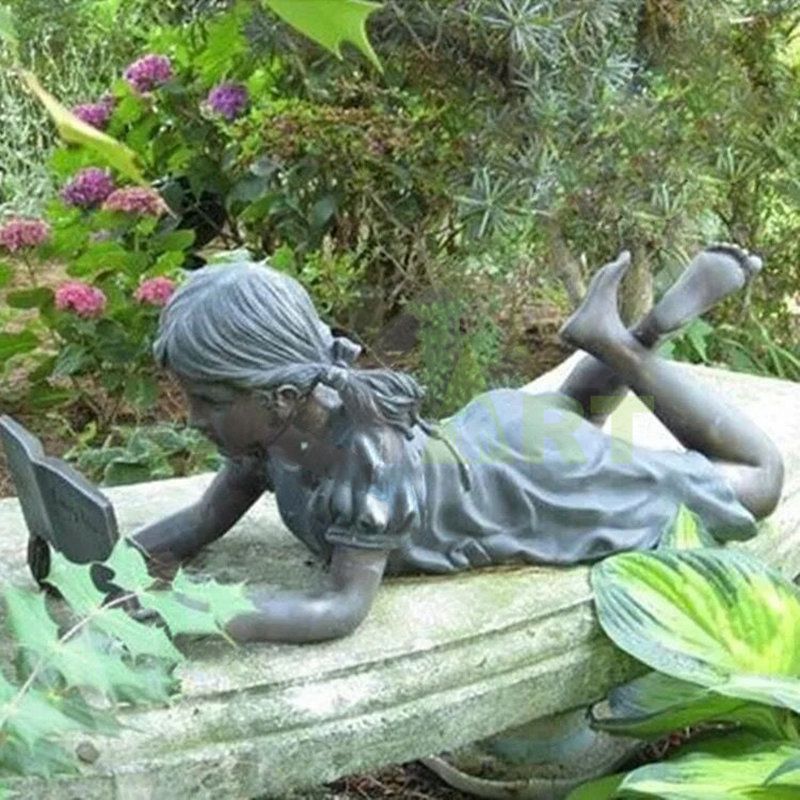 The little girl sat on the stump reading a book