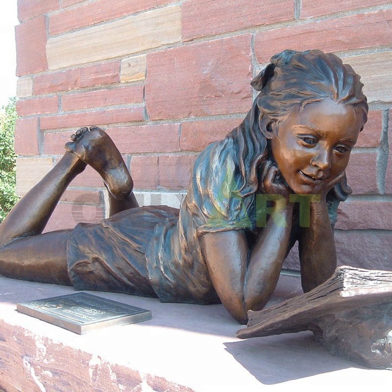 On the stone bench a little girl was climbing to read a book