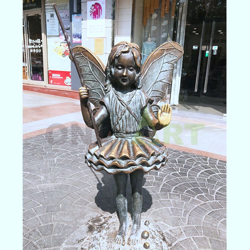 A little girl sitting on a globe