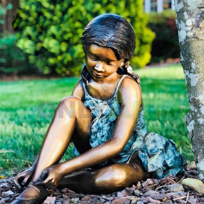 The little girl and her little rabbit under the tree