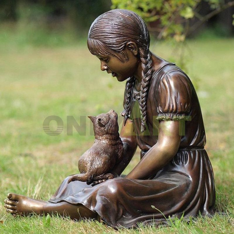 What is the little boy looking at on the stone