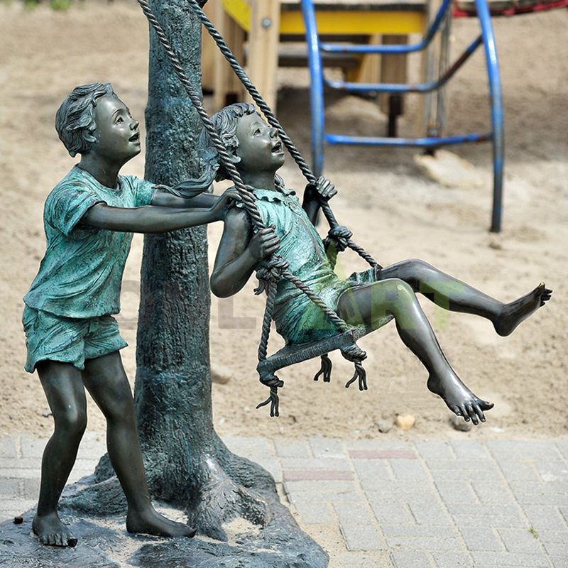 The boy played on the swing with another child