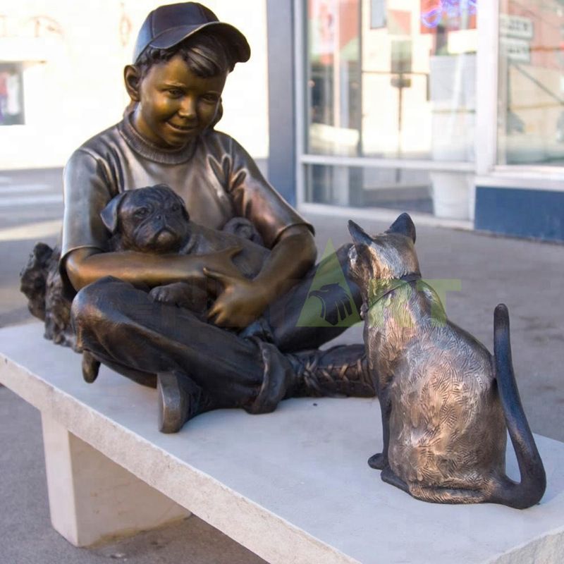 A little boy negotiates with his pets, a child sculpture
