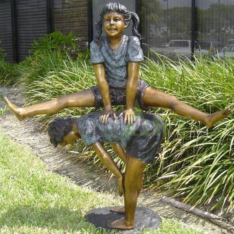 A little boy negotiates with his pets, a child sculpture