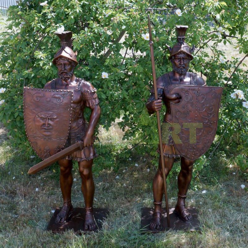 Two life-size bronze statues of Roman warriors