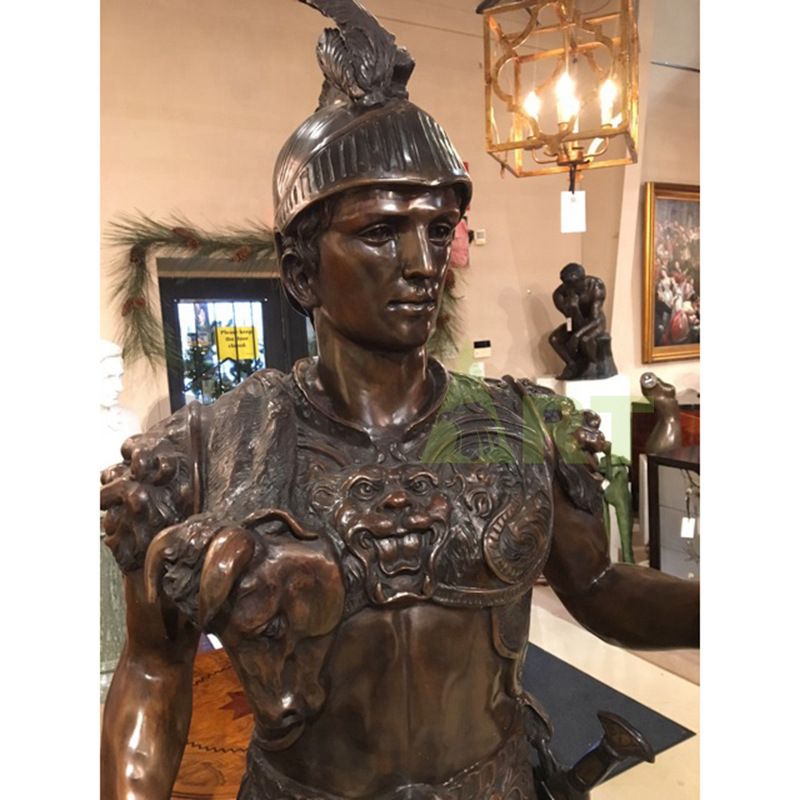 A life-size bronze statue of a Roman warrior carrying a shield and spear