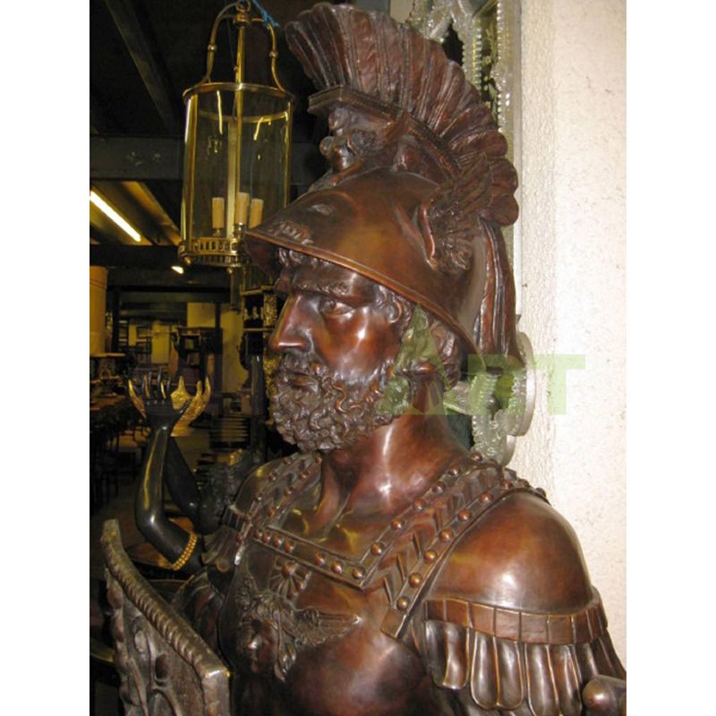 .A Bronze statue of a Spartan helmet holding a shield at the waist