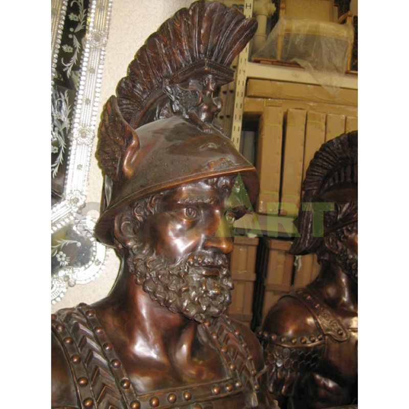 .A Bronze statue of a Spartan helmet holding a shield at the waist