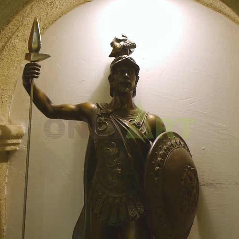 A Roman warrior squatting on a platform