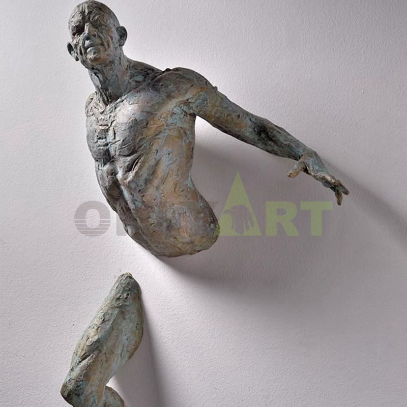 An abstract sculpture of Mateo Pugliese attached to a wall