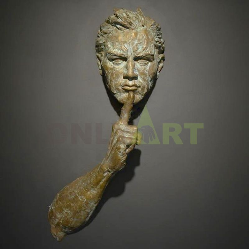 Golden closed mouth gesture bronze statue designed by Matteo