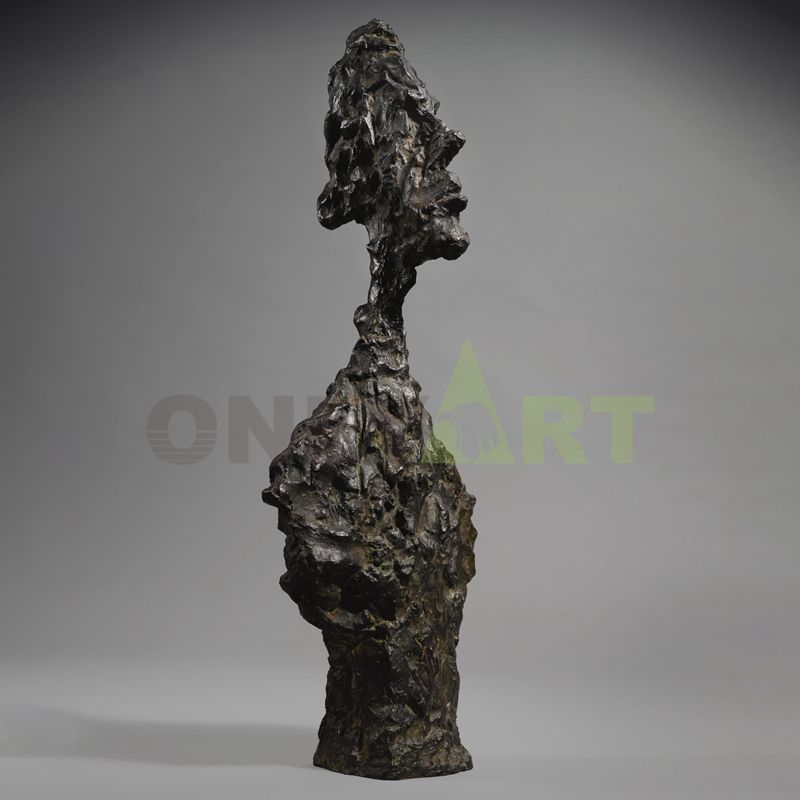 Sculpture of a man standing on his tiptoes and extending his arms - Giacometti
