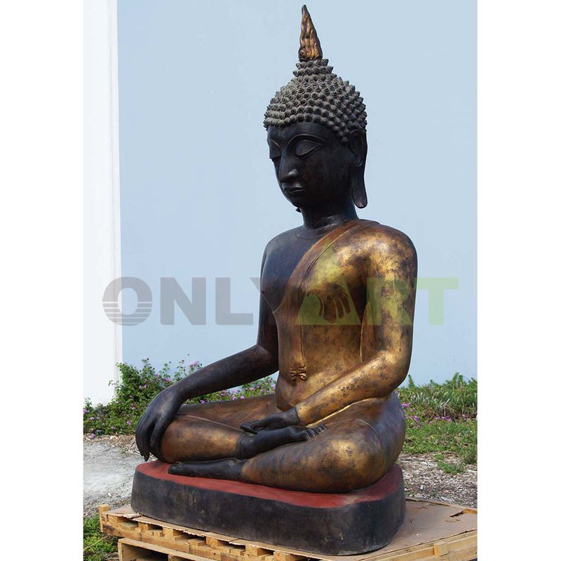 Buddha meditates on a bronze statue