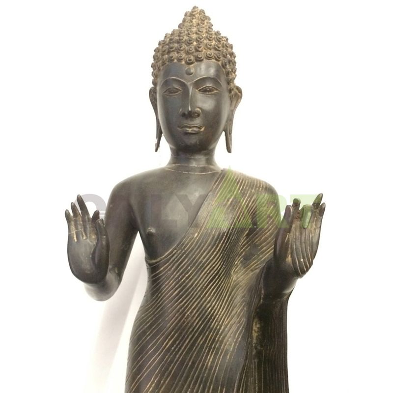 Buddha meditates on a bronze statue