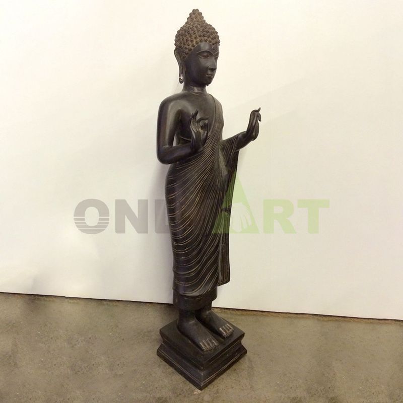 A bronze bust of a standing Buddha