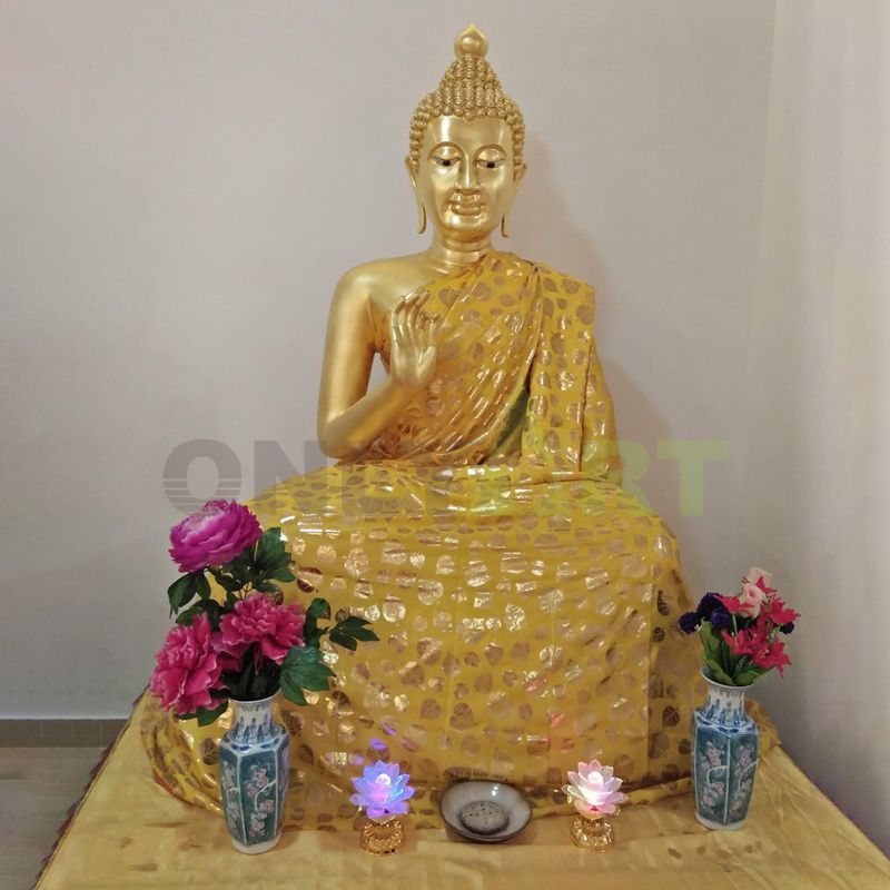 Outdoor large standing golden bronze life size Thai buddha statue