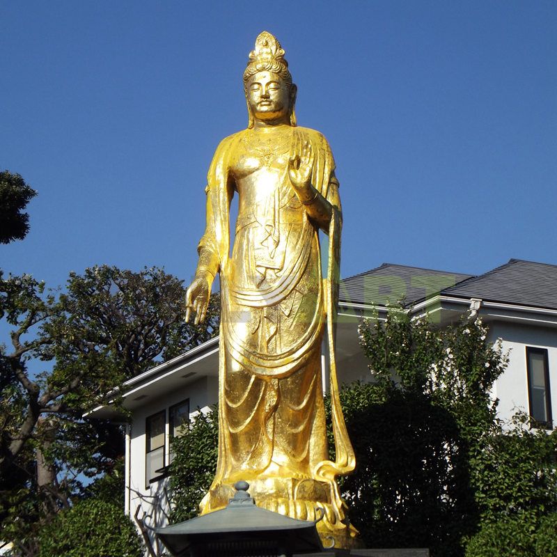 Outdoor large standing golden bronze life size Thai buddha statue