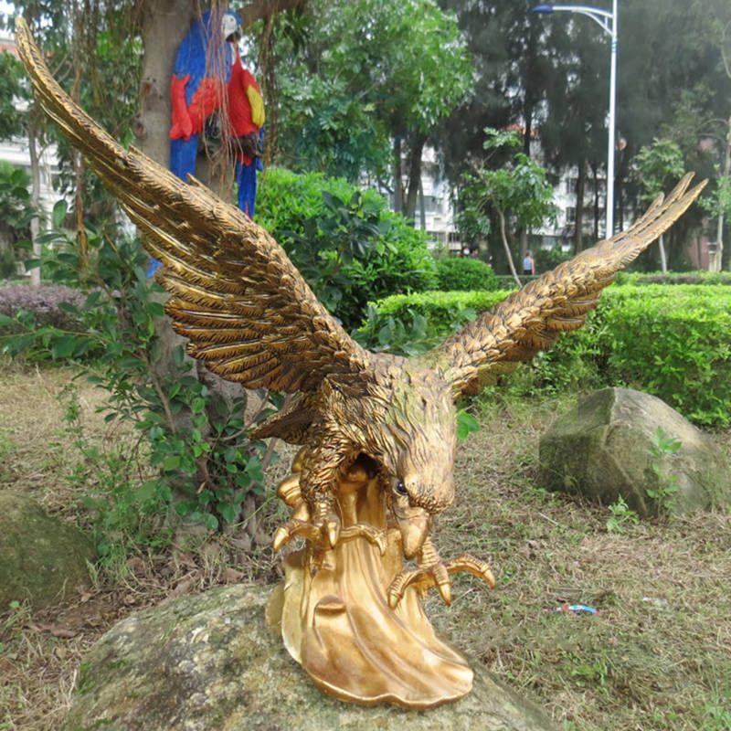 Outdoor brass animal sculptures spread wings and soar eagles