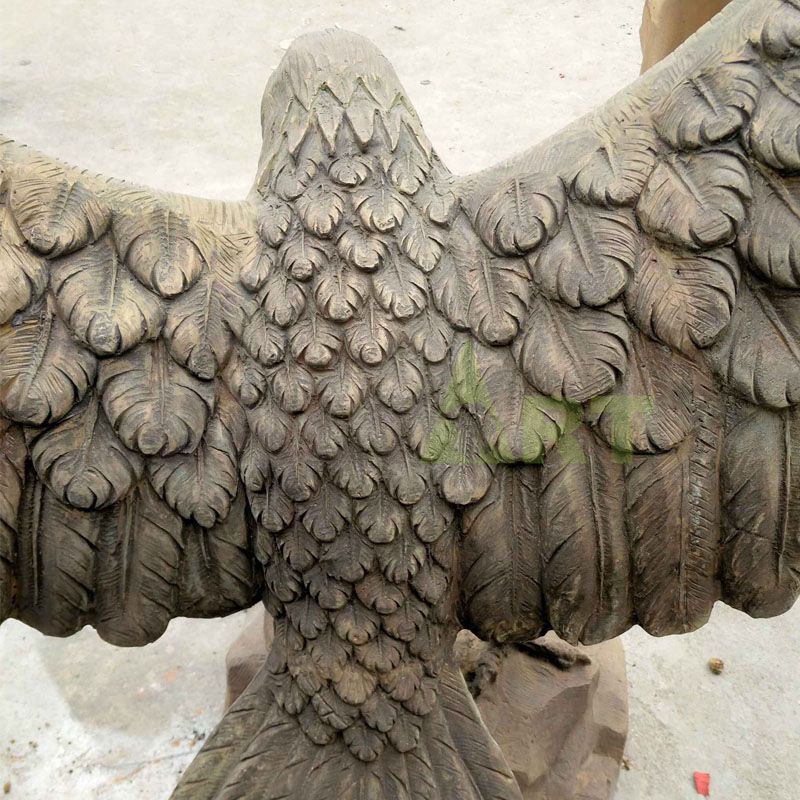 Outdoor brass animal sculptures spread wings and soar eagles