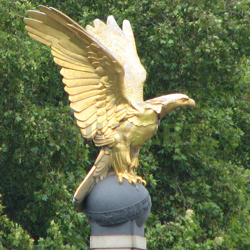 The golden eagle stood on a ball