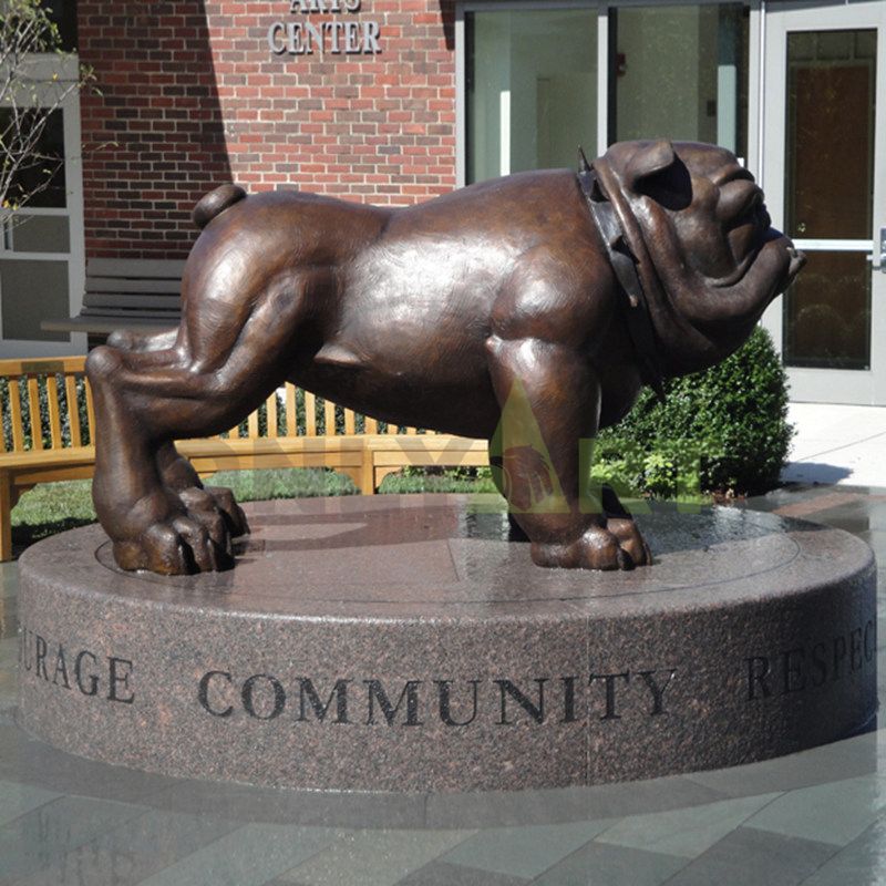 A large, muscular bulldog sculpture