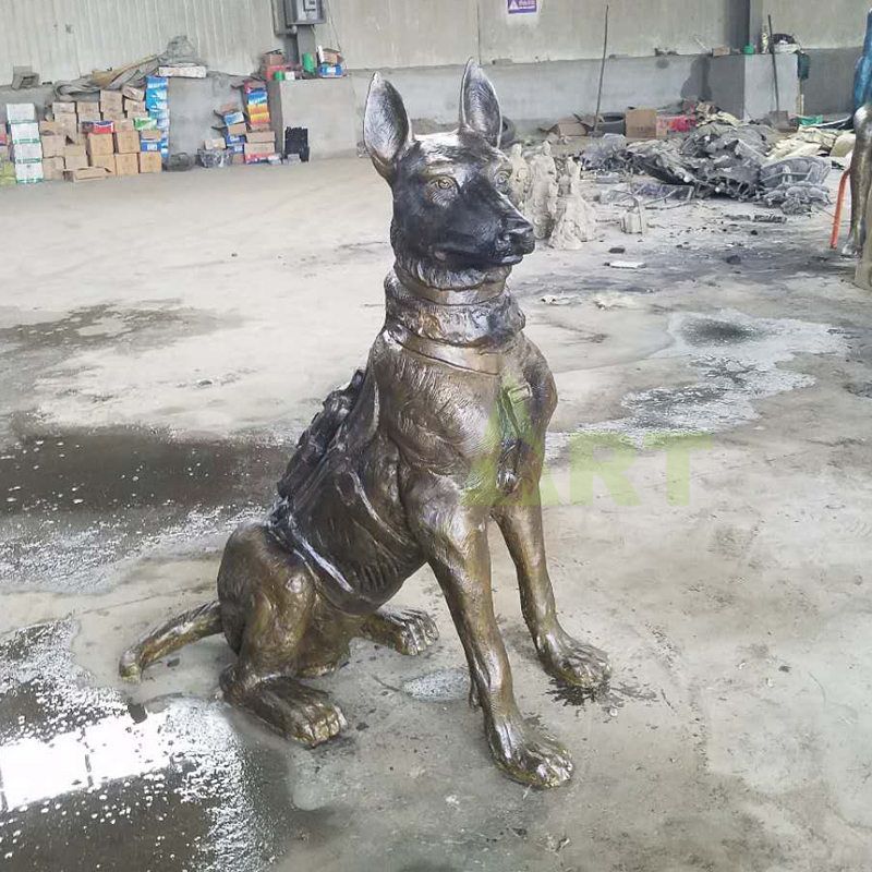 Bronze sculpture of a large Wolf dog crouching