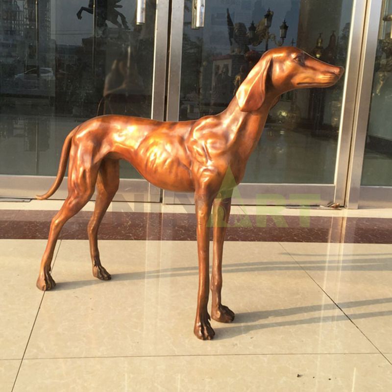 A bronze statue of a muscle-bound, fast-waisted dog