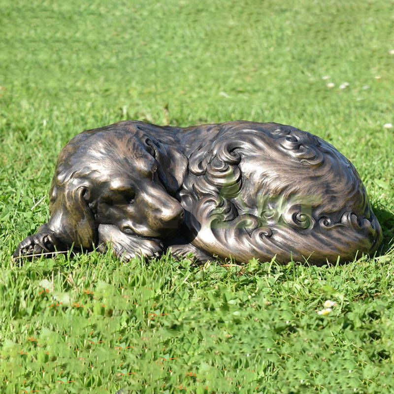 Whose Doberman sleeps on the green grass