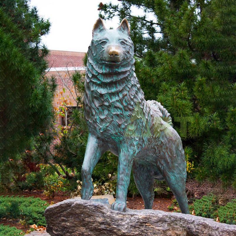 Home mounted bronze statue of two lovely German shepherds