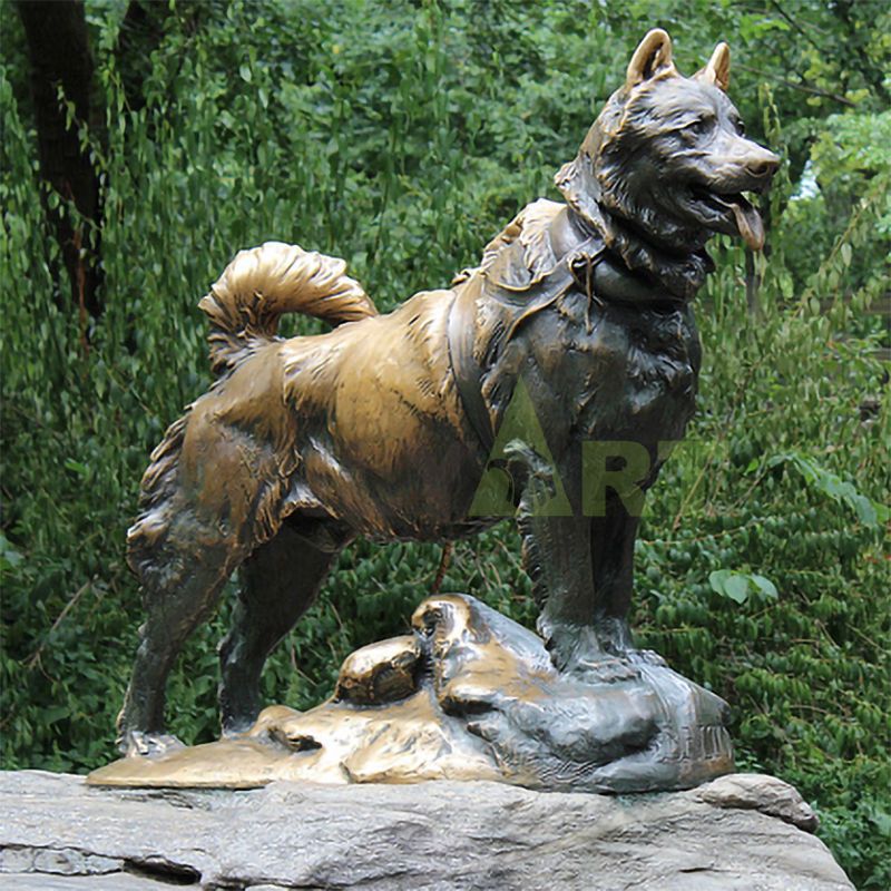 A lifelike bronze sculpture of a Doberman Dog in the jungle