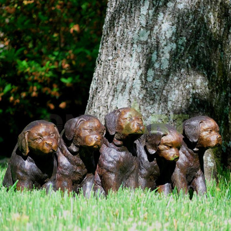 A bronze dog sculpture that captures a swallow