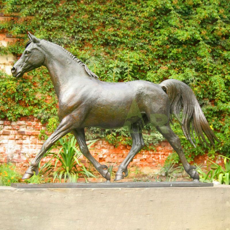 A statue of a quiet mane horse with its head tilted