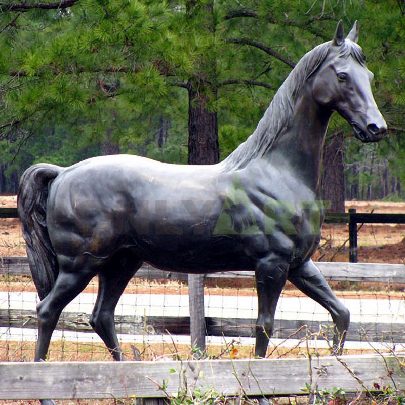 A sculpture of a strong horse in a stable
