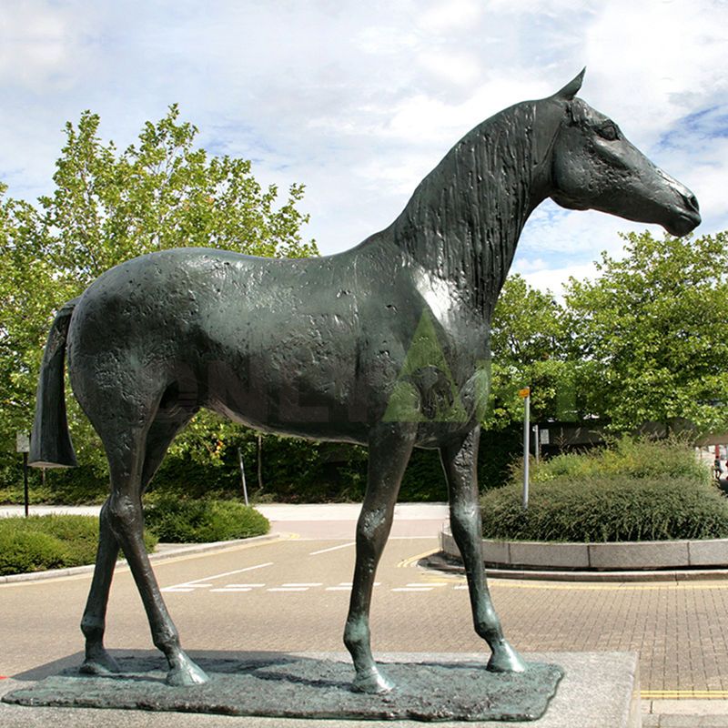 A sculpture of a strong horse in a stable