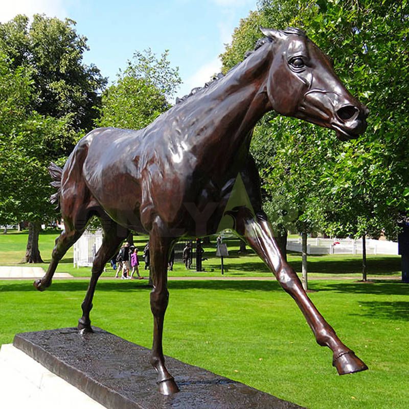 A statue of a horse dancing on the lawn