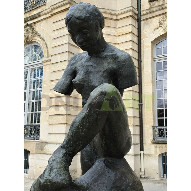 Bronze sculpture of a girl with broken arm designed by Rodin