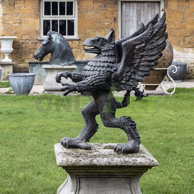 A bronze griffin walks on the lawn