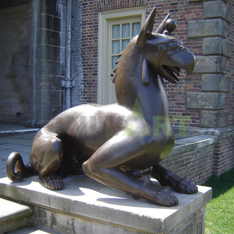 A sculpture of a gargoyle with the head of an eagle and the feet of a lion