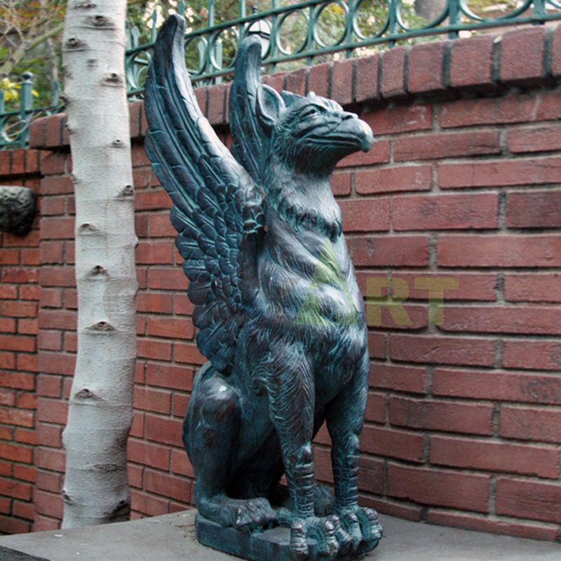 A sculpture of a gargoyle with the head of an eagle and the feet of a lion