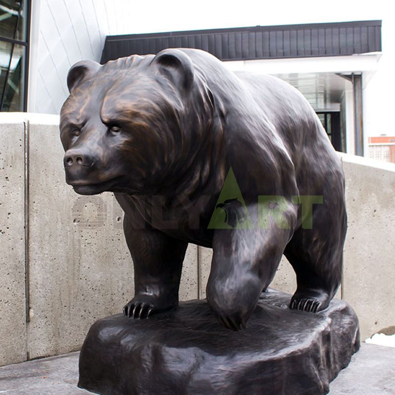 A bronze sculpture of a beautiful woman and a brown bear family