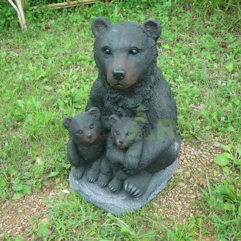 Mother Bear is sitting with baby bear on the lawn