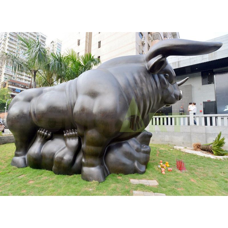 Bronze bull sitting on a chair