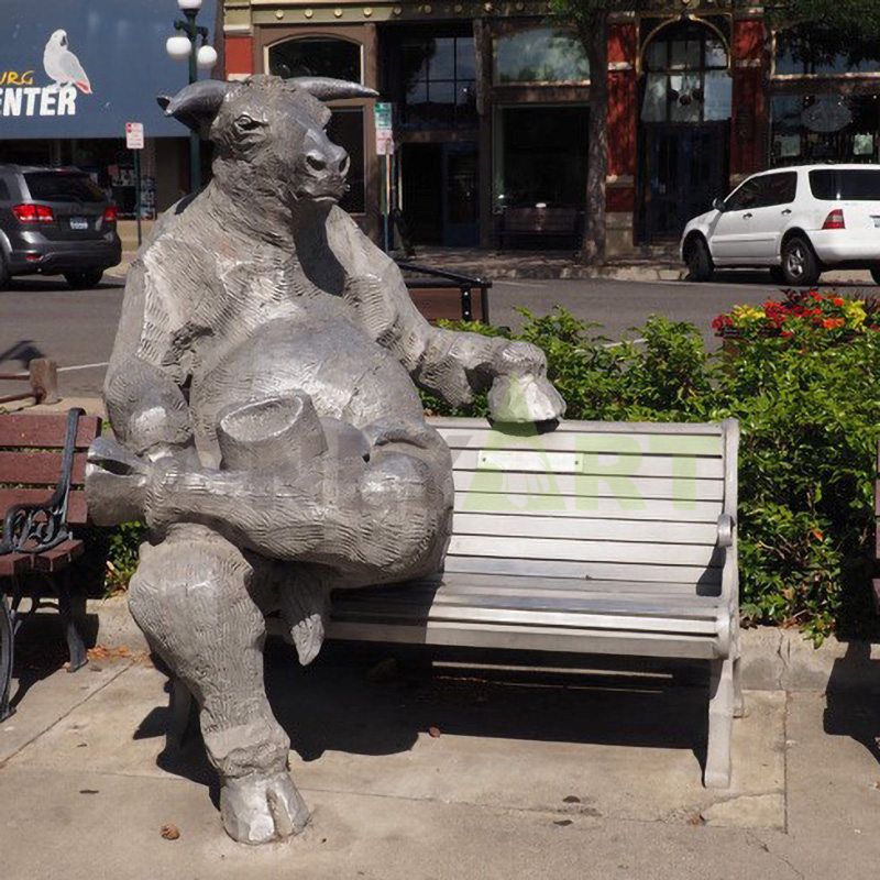 Bronze bull sitting on a chair